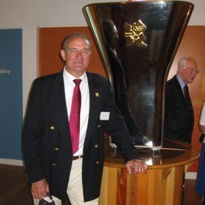 Malcolm Knight with the Olympic Cauldron in the River and Rowing Museum at Henley