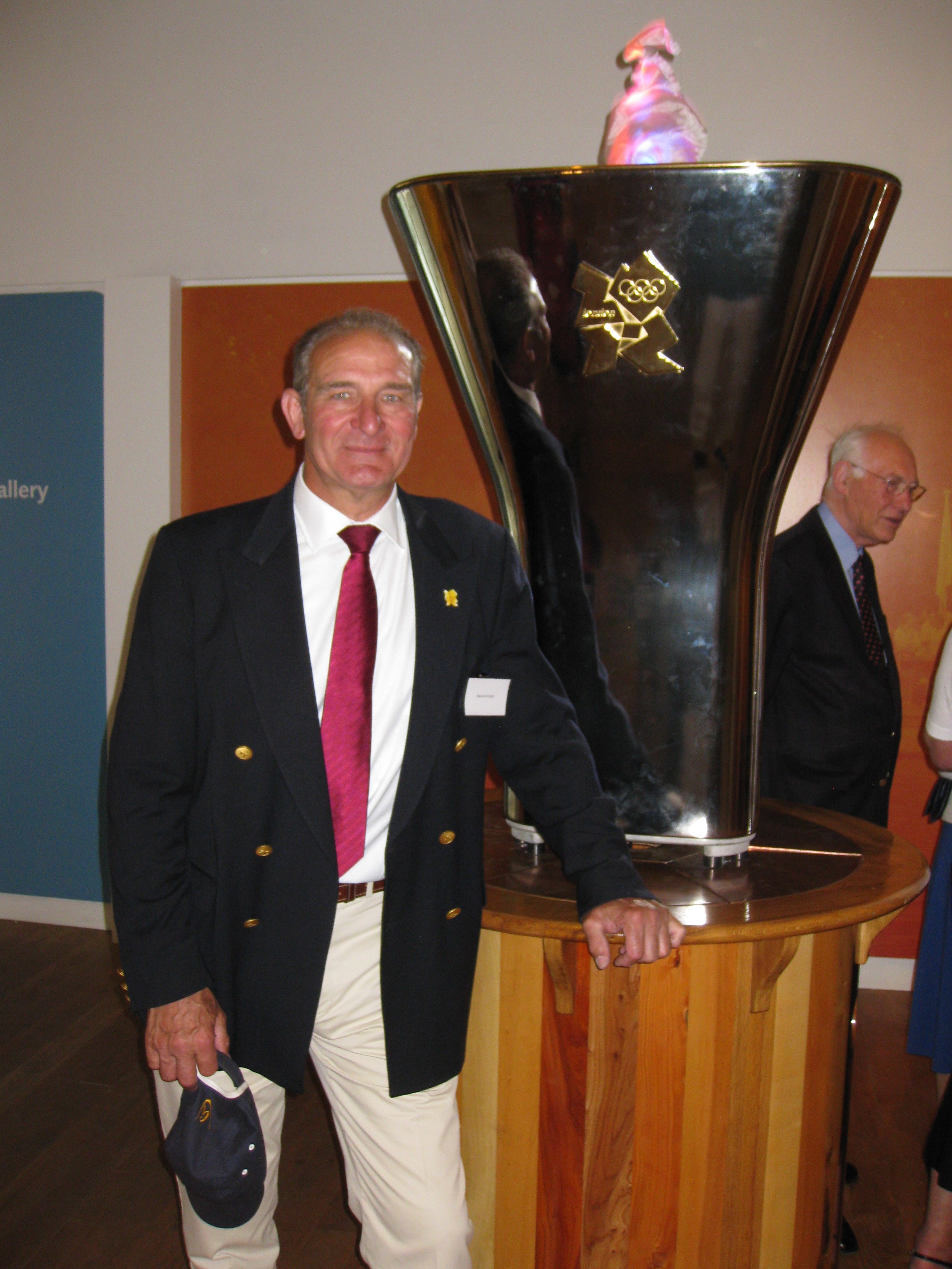 Malcolm Knight with the Olympic Cauldron in the River and Rowing Museum at Henley