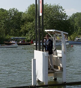 An umpire a timing station on the Henley course