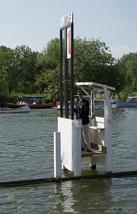 An umpire a timing station on the Henley course