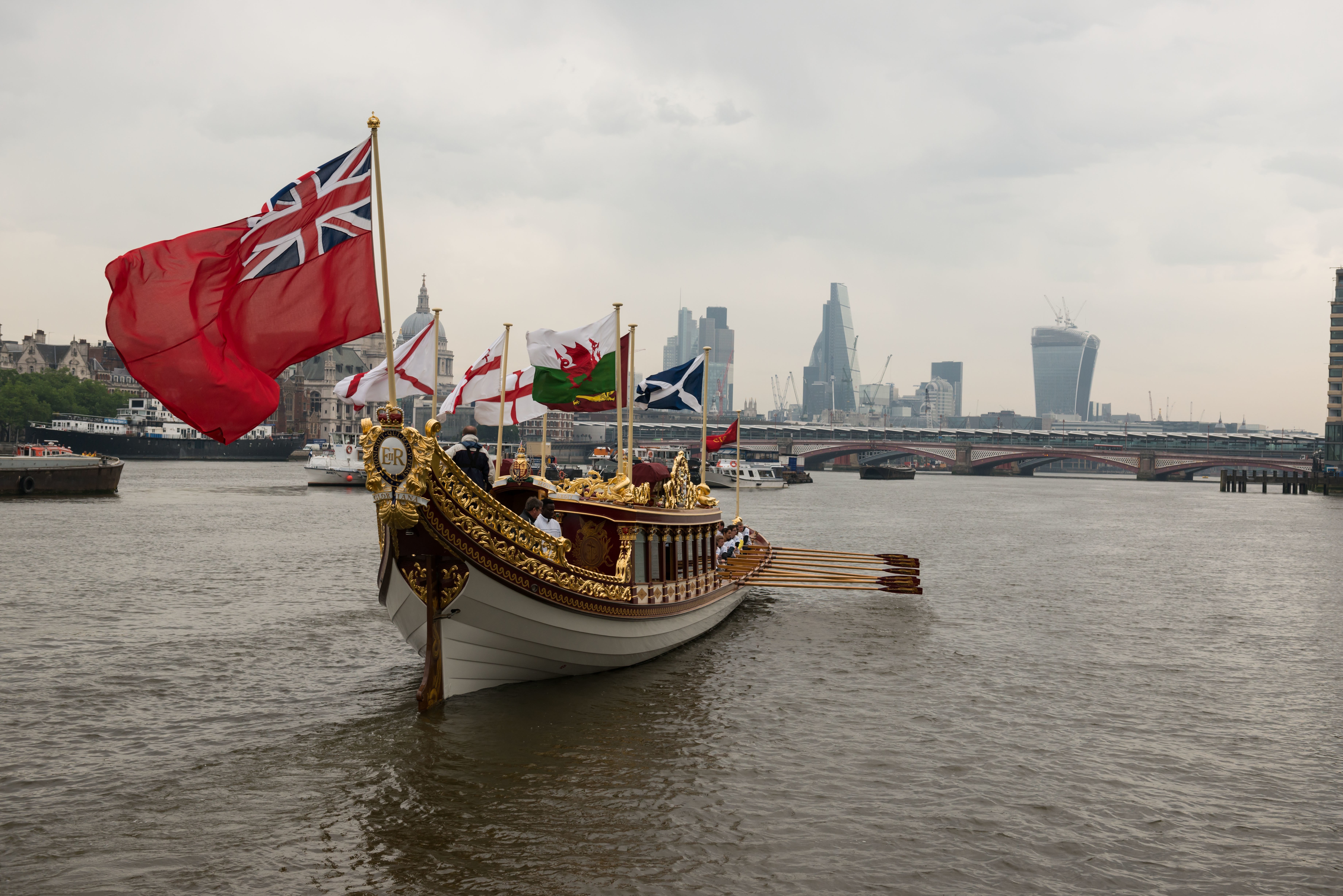 7/6/14. Commonwealth Baton Relay. The Queen's Royal Barge, 'Gloriana', is rowed up the Thames with the Commonwealth Baton aboard. Credit: Port of London Authority/TW/Ben Fitzpatrick.