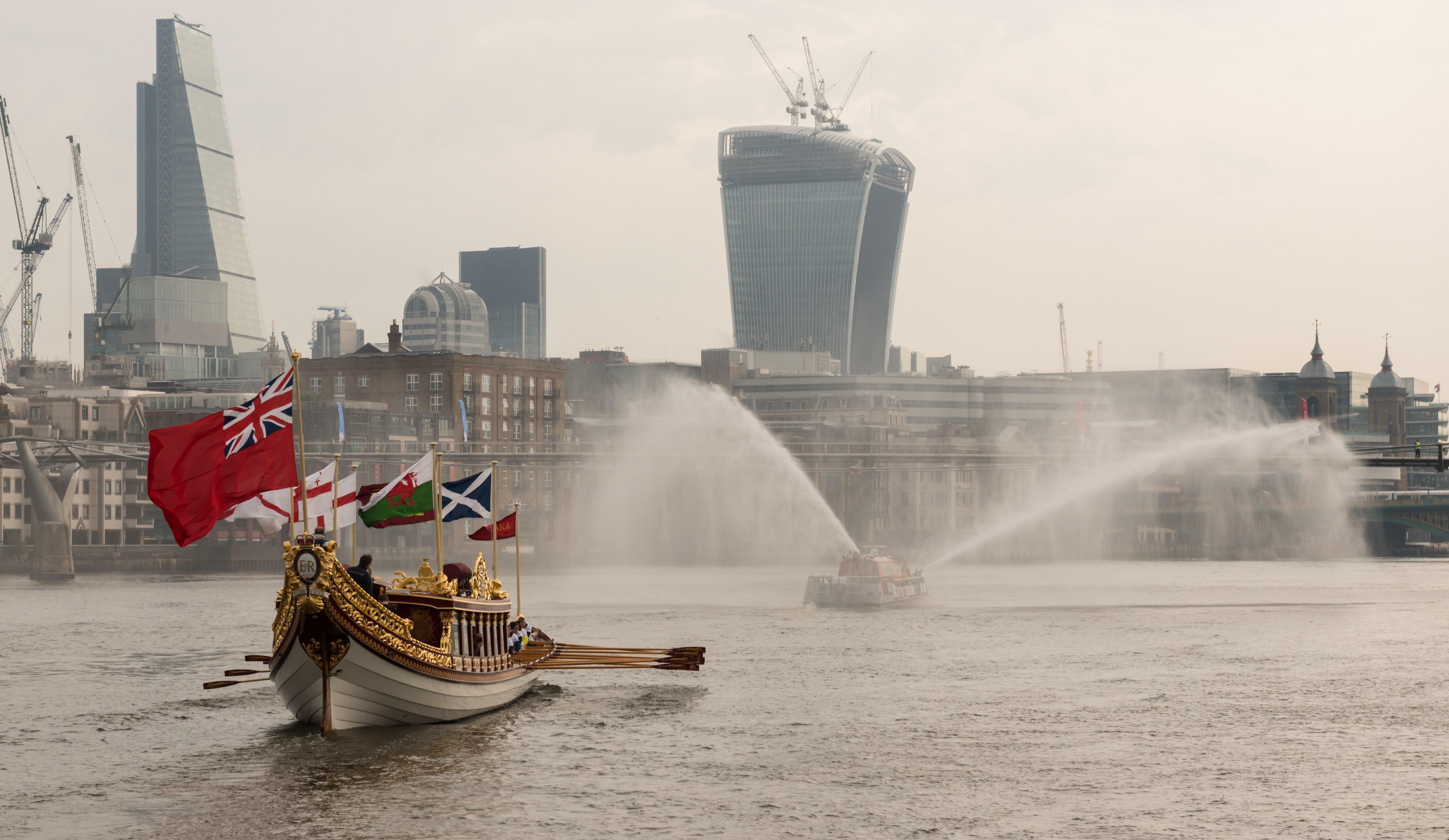 7/6/14. Commonwealth Baton Relay. The Queen's Royal Barge, 'Gloriana', is rowed up the Thames with the Commonwealth Baton aboard. Credit: Port of London Authority/TW/Ben Fitzpatrick.