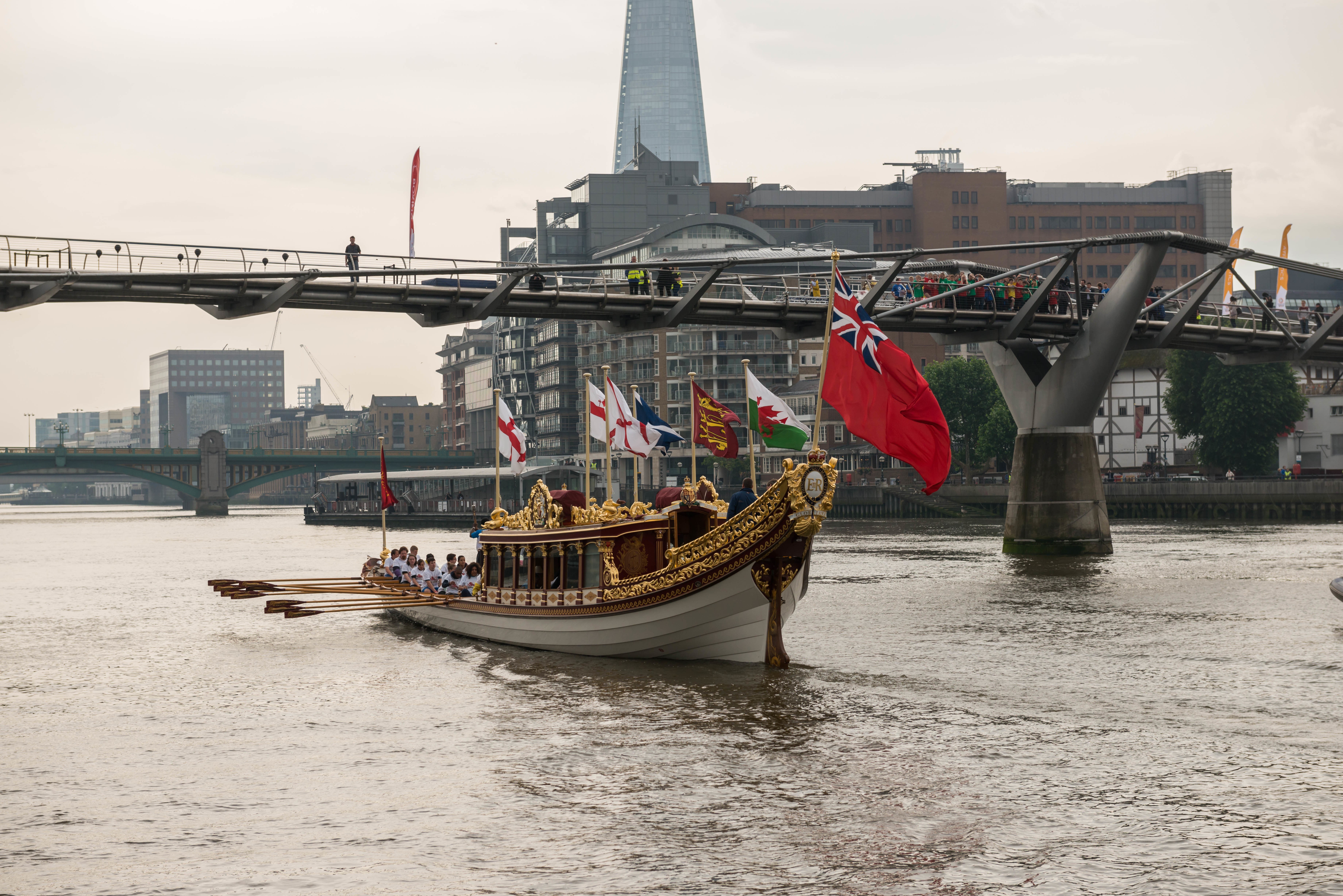 7/6/14. Commonwealth Baton Relay. The Queen's Royal Barge, 'Gloriana', is rowed up the Thames with the Commonwealth Baton aboard. Credit: Port of London Authority/TW/Ben Fitzpatrick.
