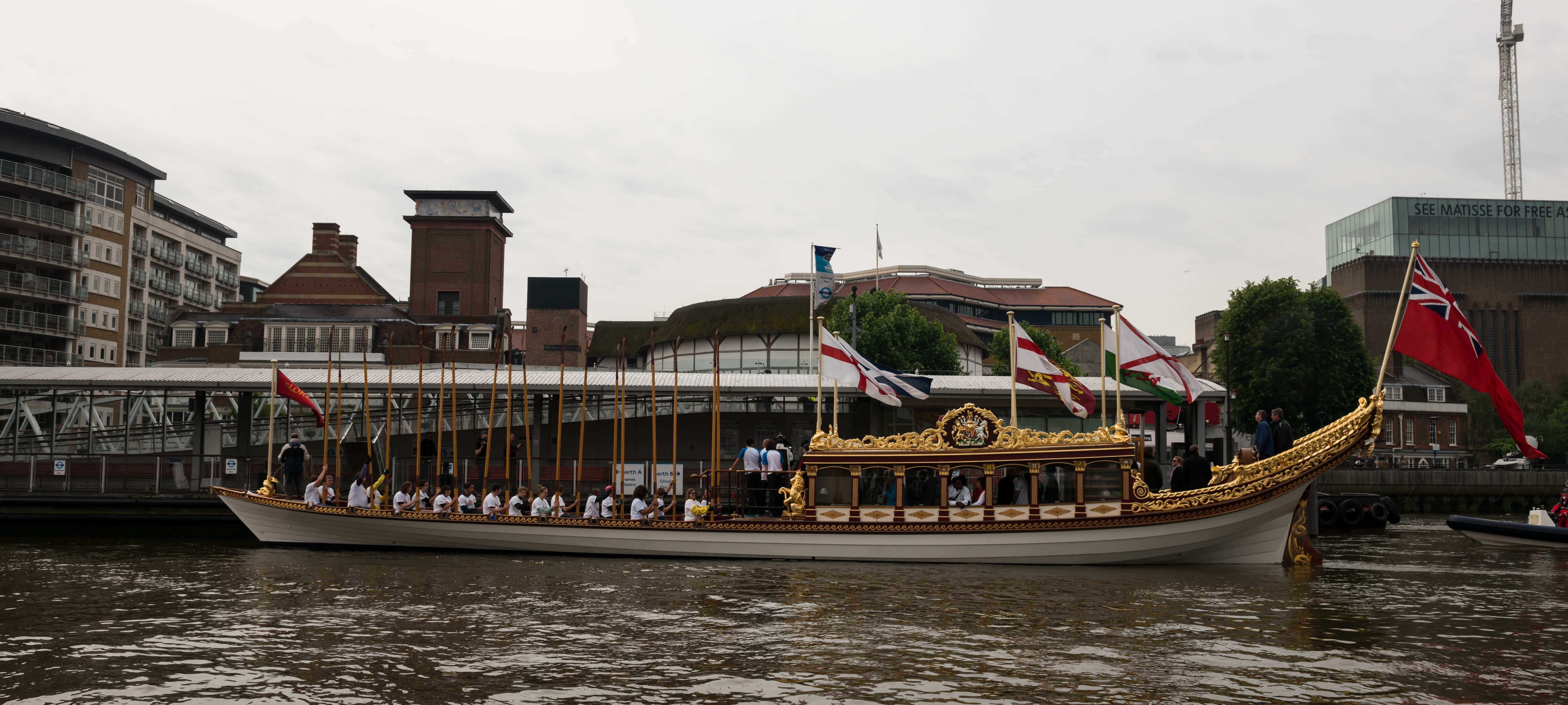 7/6/14. Commonwealth Baton Relay. The Queen's Royal Barge, 'Gloriana', is rowed up the Thames with the Commonwealth Baton aboard. Credit: Port of London Authority/TW/Ben Fitzpatrick.