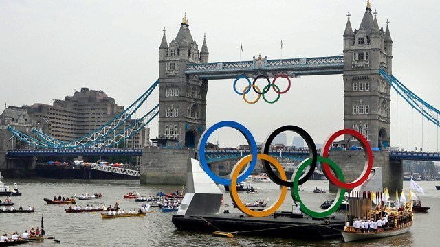 The Olympic Rings Barge and escort