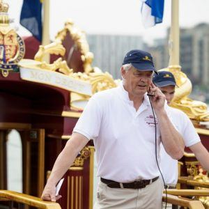 Matthew Gordon, the Cox on board the MV Gloriana as it rows up the Thames as part of HM The Queen's 90th Birthday celebrations