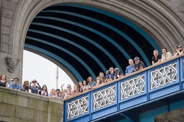 The public watch the Gloriana MV Gloriana rows up the Thames as part of HM The Queen's 90th Birthday celbrations