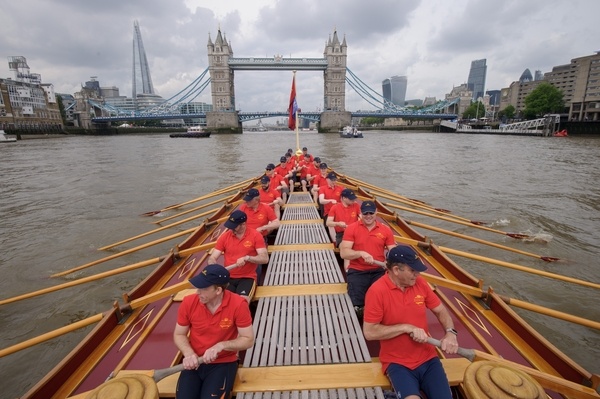 MV Gloriana rows up the Thames as part of HM The Queen's 90th Birthday celbrations