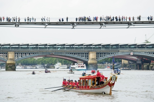 The small boat flotilla behind the Gloriana