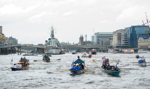 The small boat flotilla behind the Gloriana