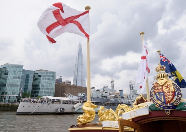 The Gloriana passes HMS Belfast MV Gloriana rows up the Thames as part of HM The Queen's 90th Birthday celbrations