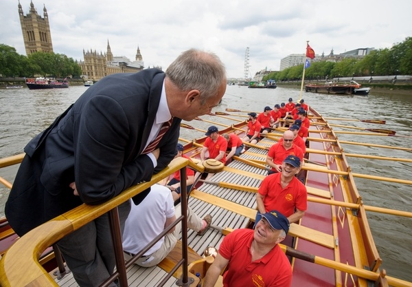 Sir Steve Redgrave talks to the crew of The Gloriana MV Gloriana rows up the Thames as part of HM The Queen's 90th Birthday celbrations