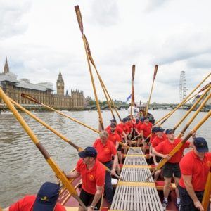 The crew of the Gloriana 'toss oars' as a salute to the Palace of Westminster MV Gloriana rows up the Thames as part of HM The Queen's 90th Birthday celbrations