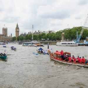 The small boat flotilla behind the Gloriana MV Gloriana rows up the Thames as part of HM The Queen's 90th Birthday celbrations