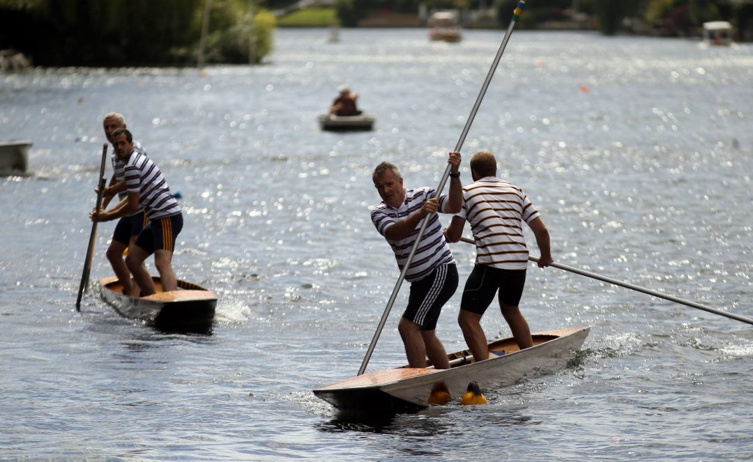 Mark Vellacott and Peter Sharp (r) take on Kit Nairne and Peter Williams (l) in the Thames Punting Club championships in Maidenhead, Berkshire PRESS ASSOCIATION Photo. Picture date: Sunday August 7, 2016. See PA story . Photo credit should read: Steve Parsons/PA Wire